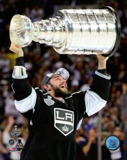 ALEC MARTINEZ HOLDING STANLEY CUP 2014 8X10 PHOTO